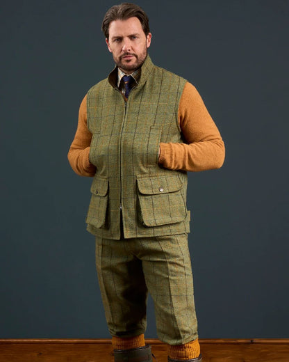 Dark Moss Coloured Alan Paine Rutland Tweed Waistcoat on indoor background 