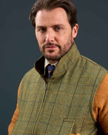Dark Moss Coloured Alan Paine Rutland Tweed Waistcoat on indoor background 