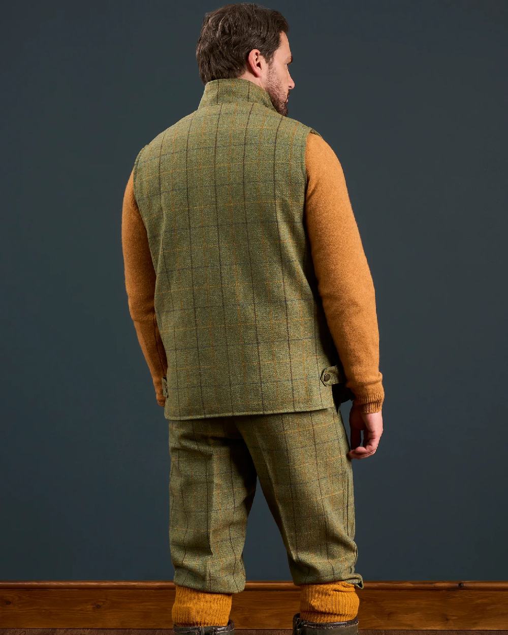 Dark Moss Coloured Alan Paine Rutland Tweed Waistcoat on indoor background 