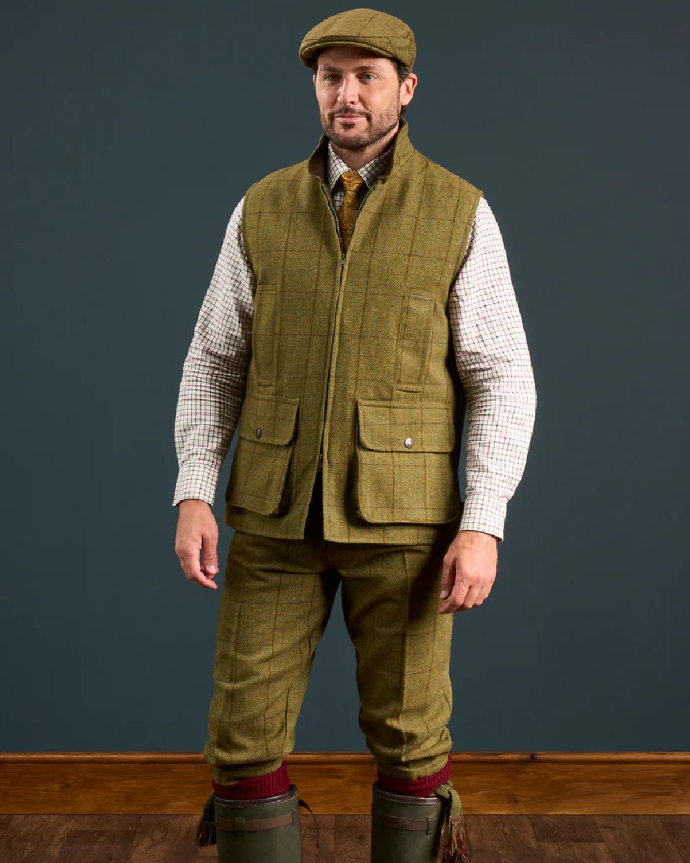 Lichen coloured Alan Paine Rutland Tweed Waistcoat on indoor background 