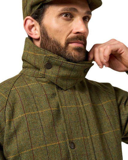 Green Ash coloured Alan Paine Rutland Waterproof Tweed Shooting Coat on white background 