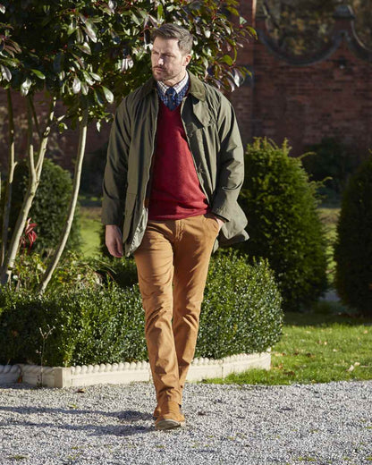 Olive coloured Alan Paine Surrey Mens Jacket on street background 