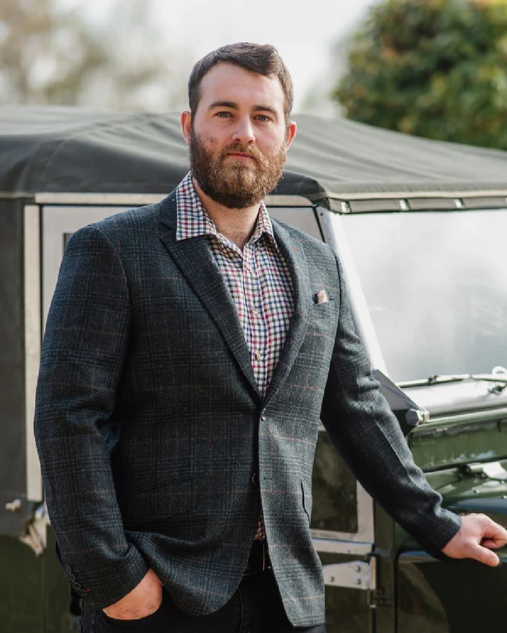 Green Check coloured Alan Paine Surrey Mens Tweed Lined Blazer on blurry background 