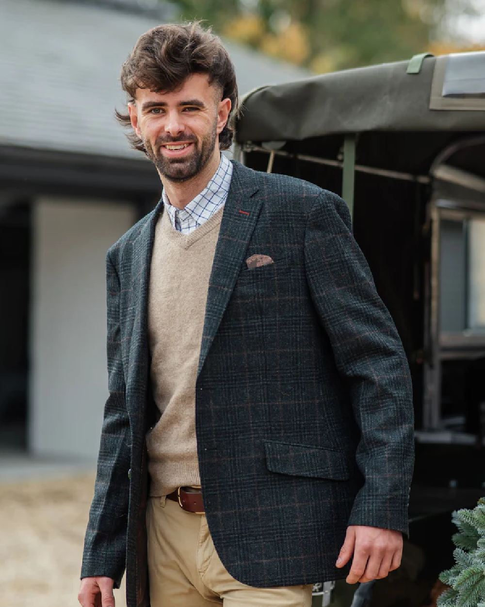 Green Check coloured Alan Paine Surrey Mens Tweed Lined Blazer on blurry background 