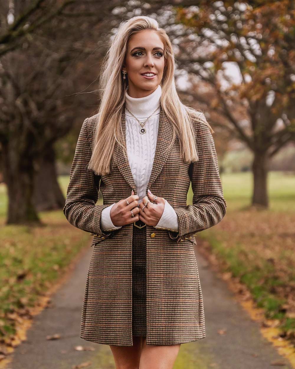 Blonde lady wearing Alan Paine Surrey Mid-Thigh Tweed Coat in Sycamore 