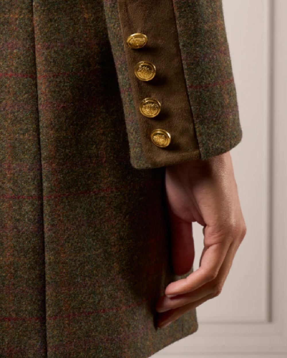 Hemlock coloured Alan Paine Surrey Mid-Thigh Tweed Coat on studio background 