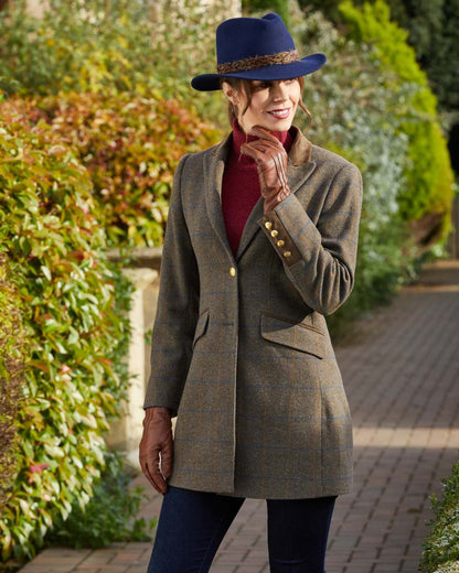 Marsh coloured Alan Paine Surrey Mid-Thigh Tweed Coat on park background 