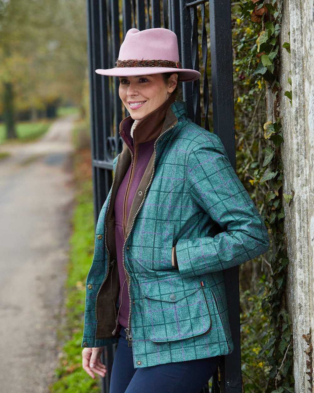 Seagrass coloured Alan Paine Womens Didsmere Coat on street background 