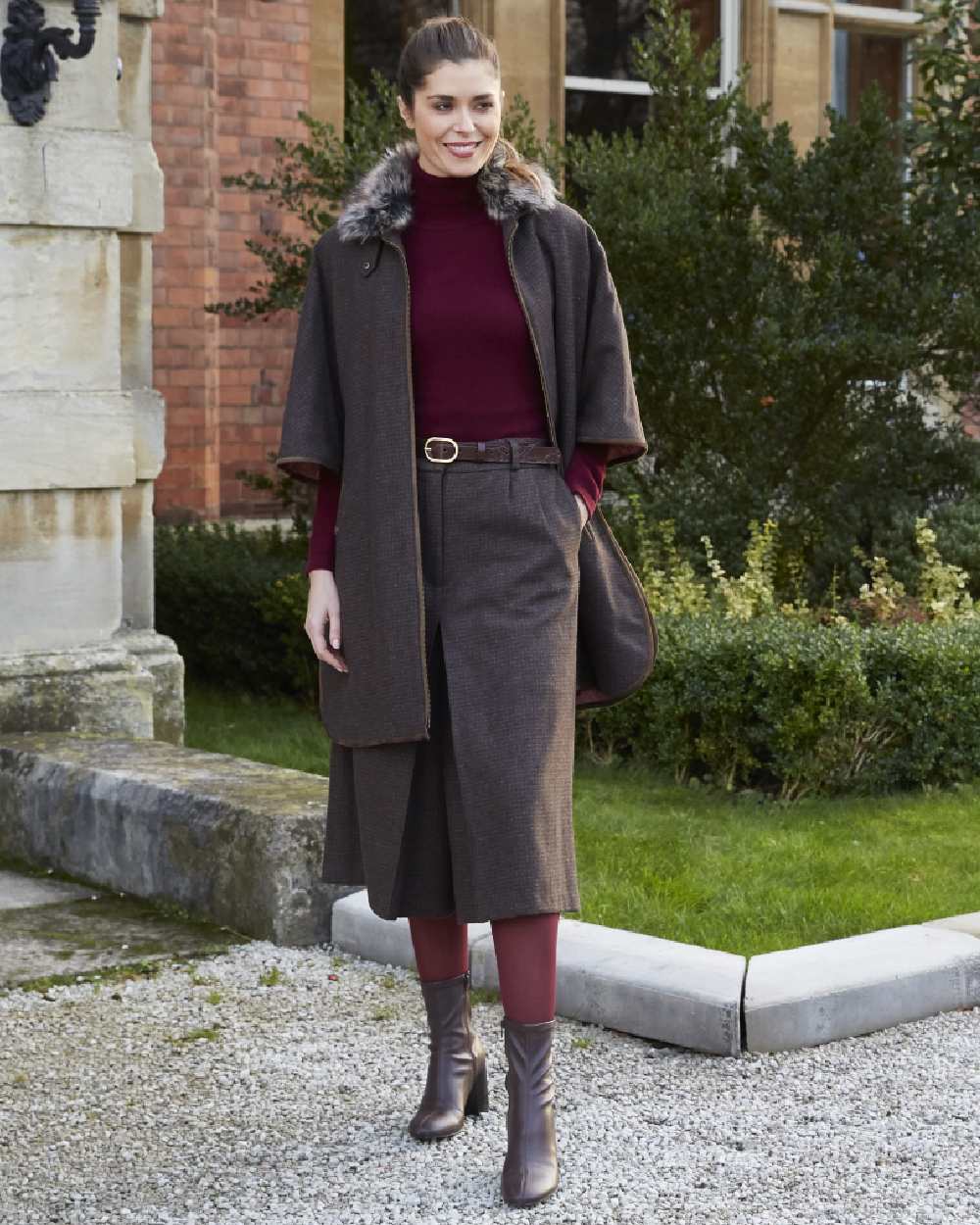 Bramble coloured Alan Paine Womens Surrey Tweed Cape on street background 