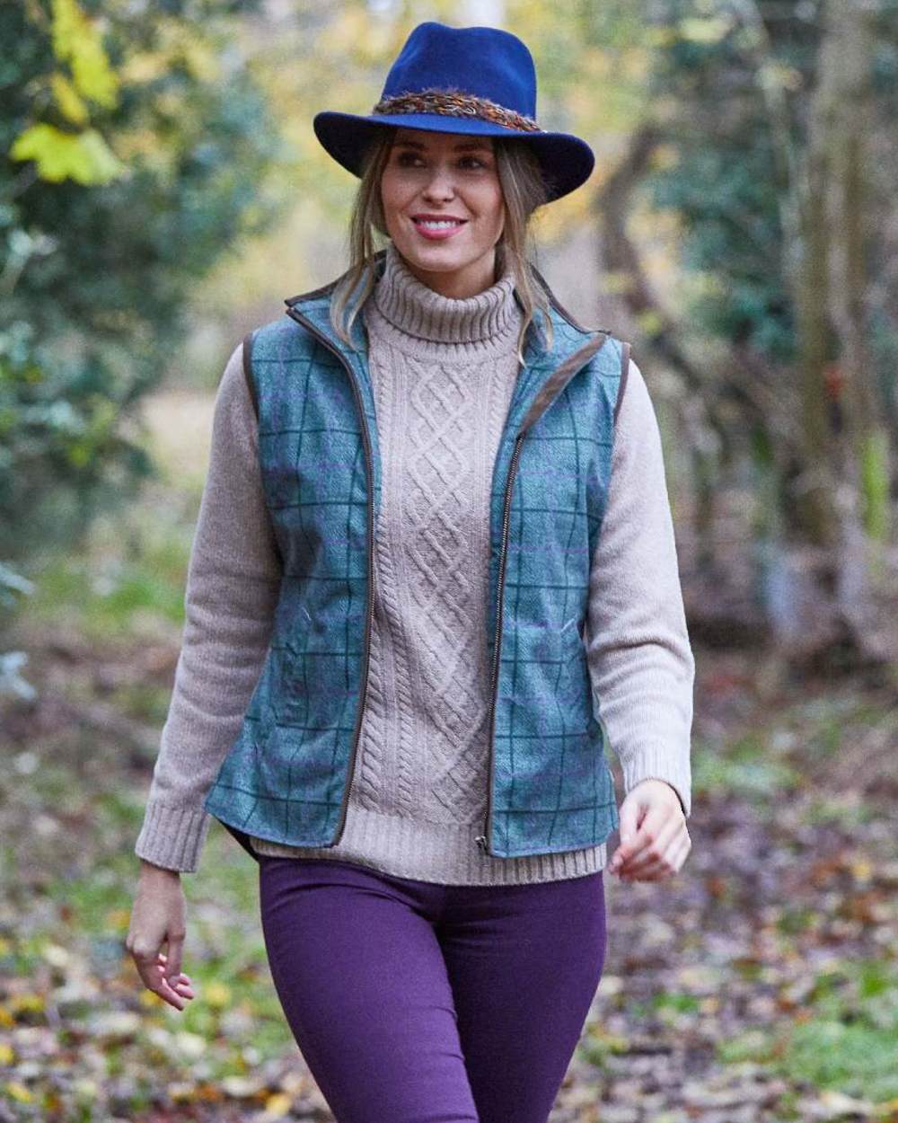 Seagrass coloured Alan Paine Womens Didsmere Gilet on forest background 