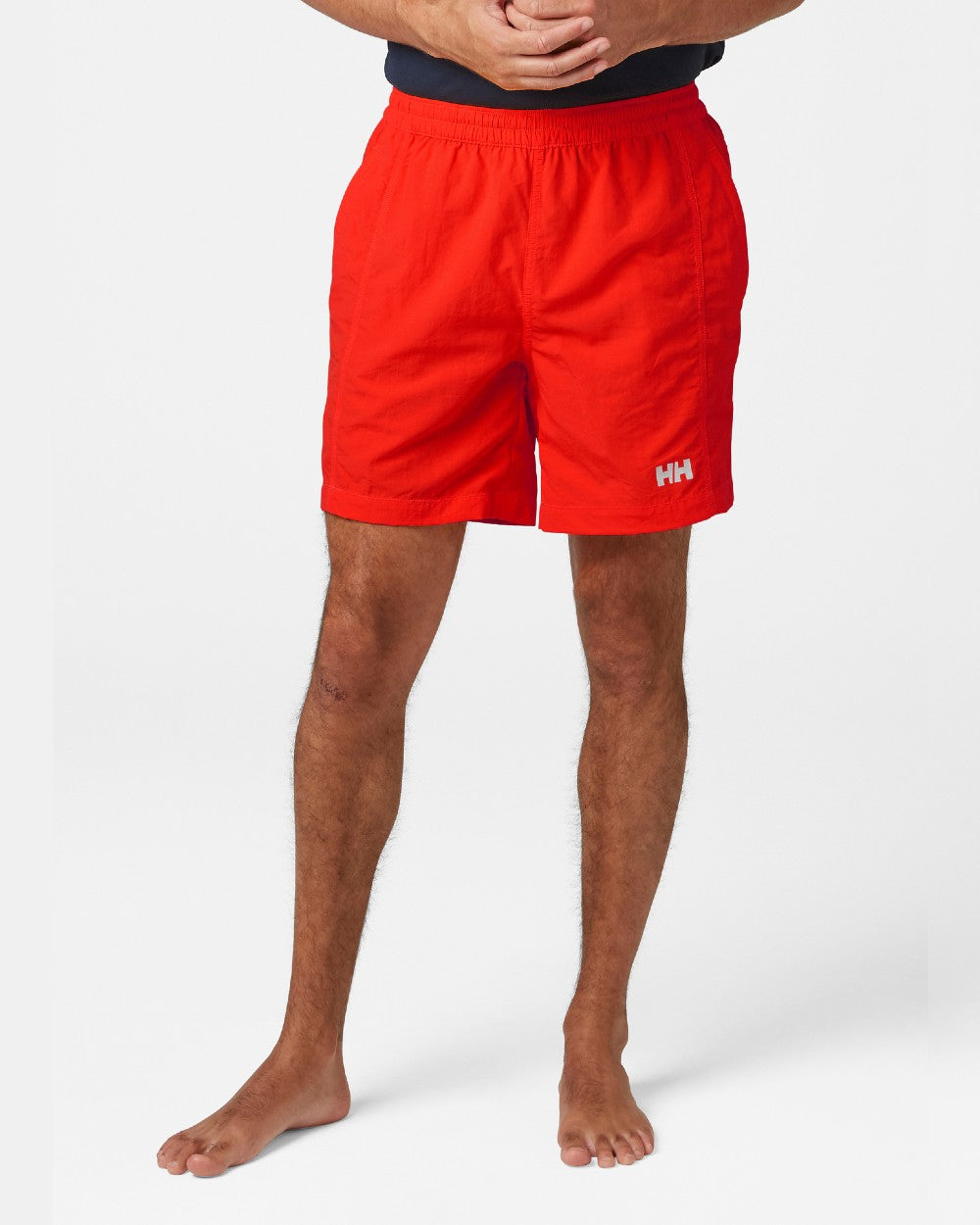 Alert Red coloured Helly Hansen Mens Calshot Trunks on a grey background 