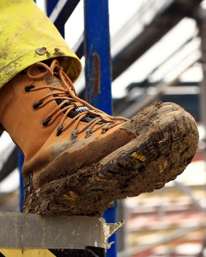 Honey coloured Amblers Safety Mens FS998 Waterproof S3 SRC Safety Boots on blurry background 