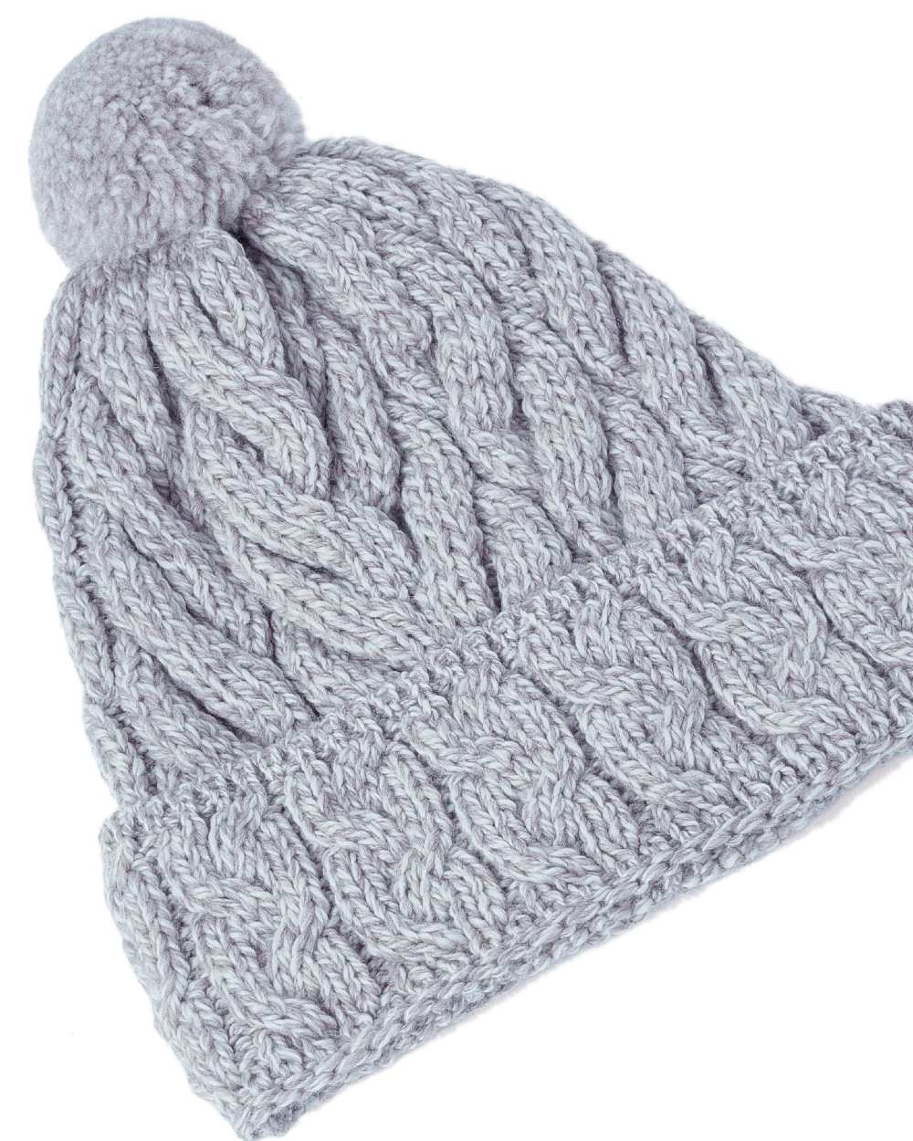 Beige Coloured Aran Chunky Knit Bobble Hat on white background 