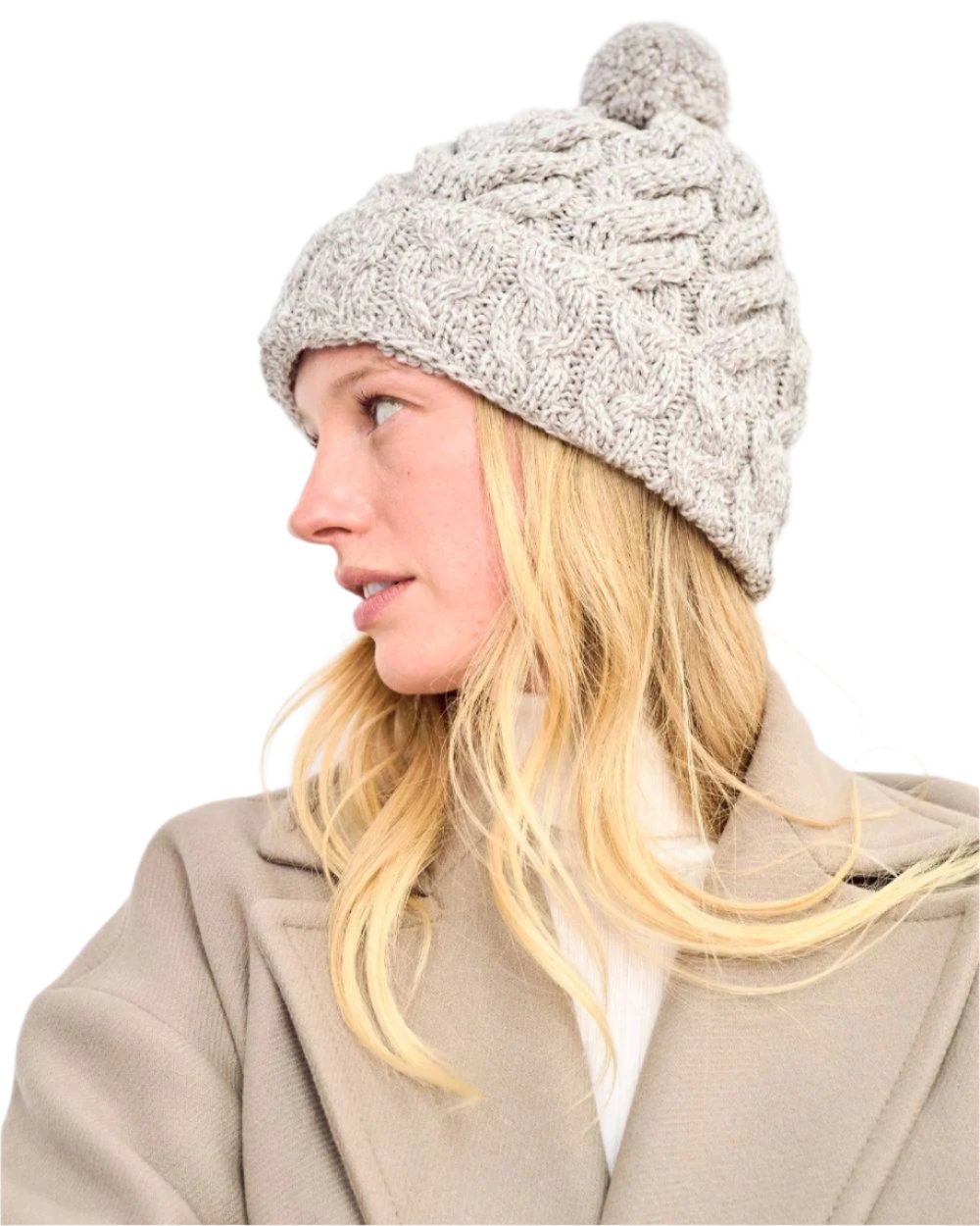 Beige Coloured Aran Chunky Knit Bobble Hat on white background 