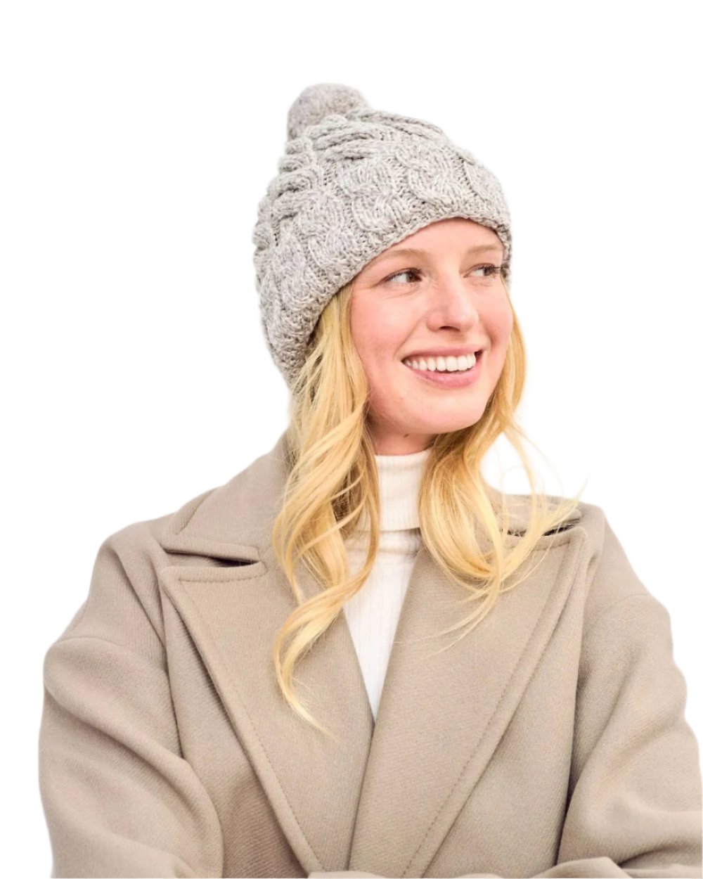 Beige Coloured Aran Chunky Knit Bobble Hat on white background 