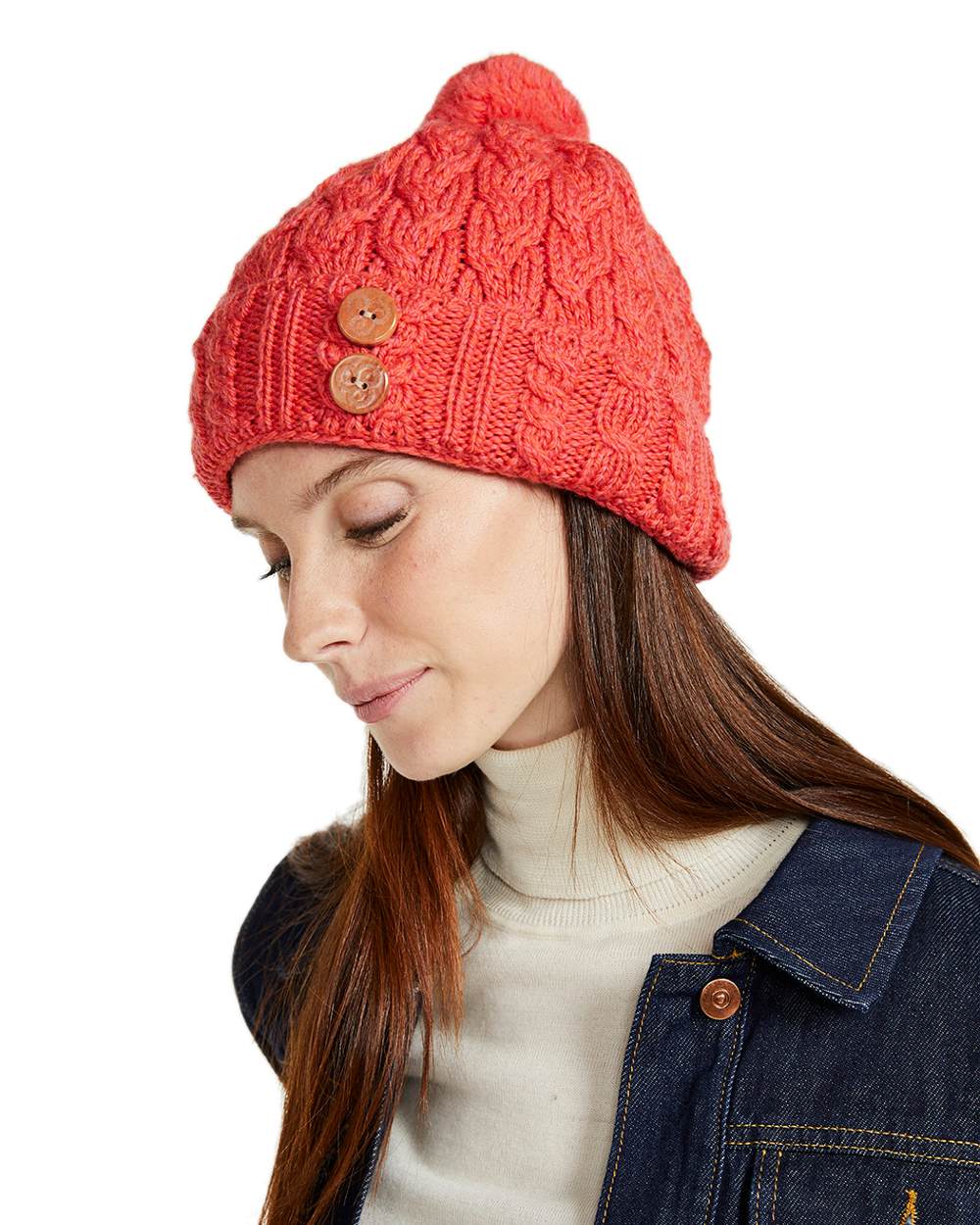 Coral Coloured Aran Chunky Knit Button Bobble Hat on white background 