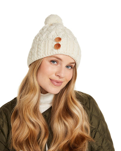 Cream Coloured Aran Chunky Knit Button Bobble Hat on white background 