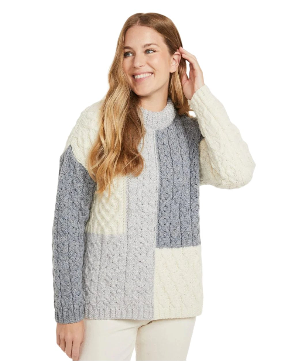 Dawn Coloured Aran Cobh Sweater on white background 