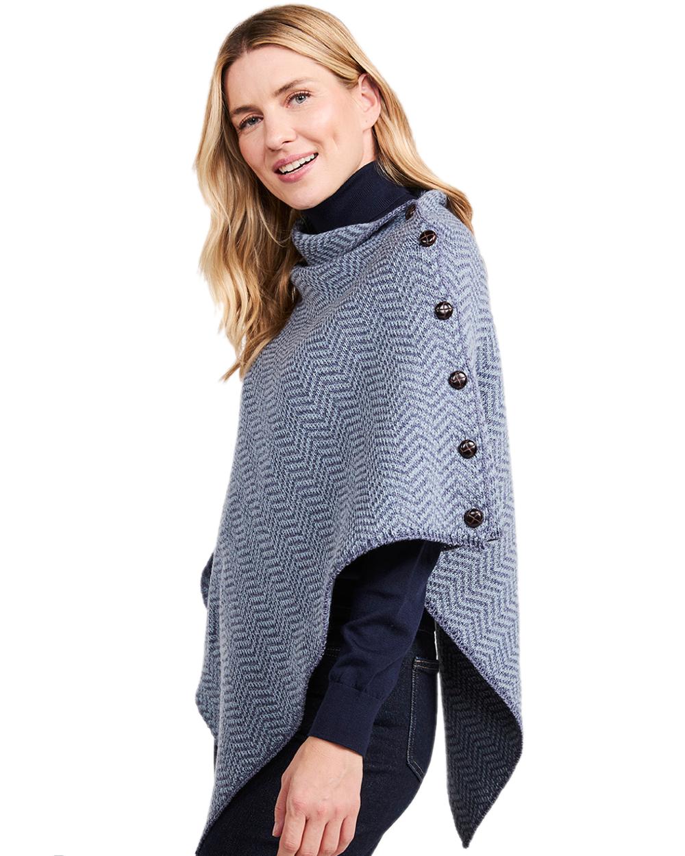 Denim Coloured Aran Herringbone Poncho with Buttons on white background 