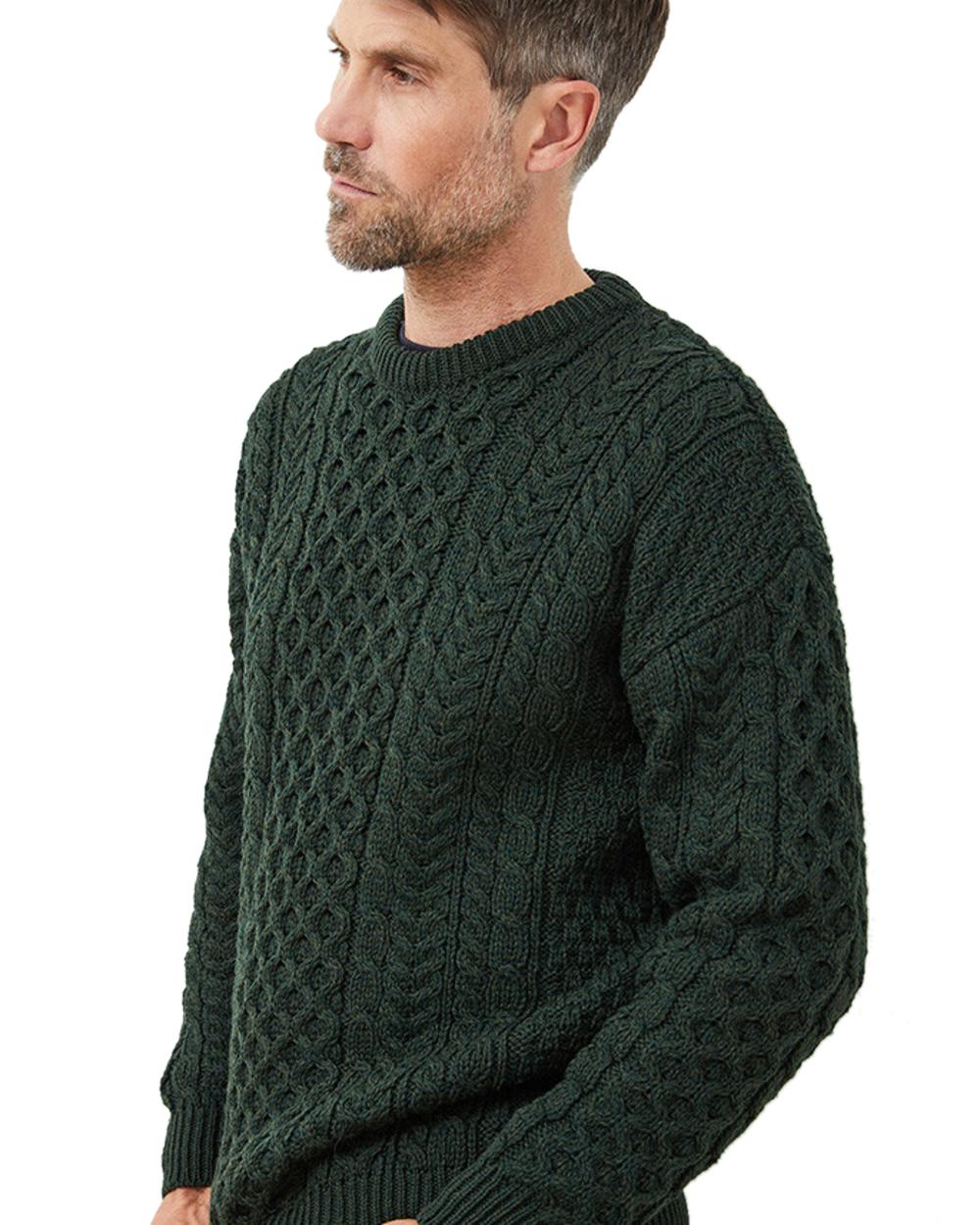 Deep Forest coloured Aran Mens Inishbofin Traditional Sweater on white background 