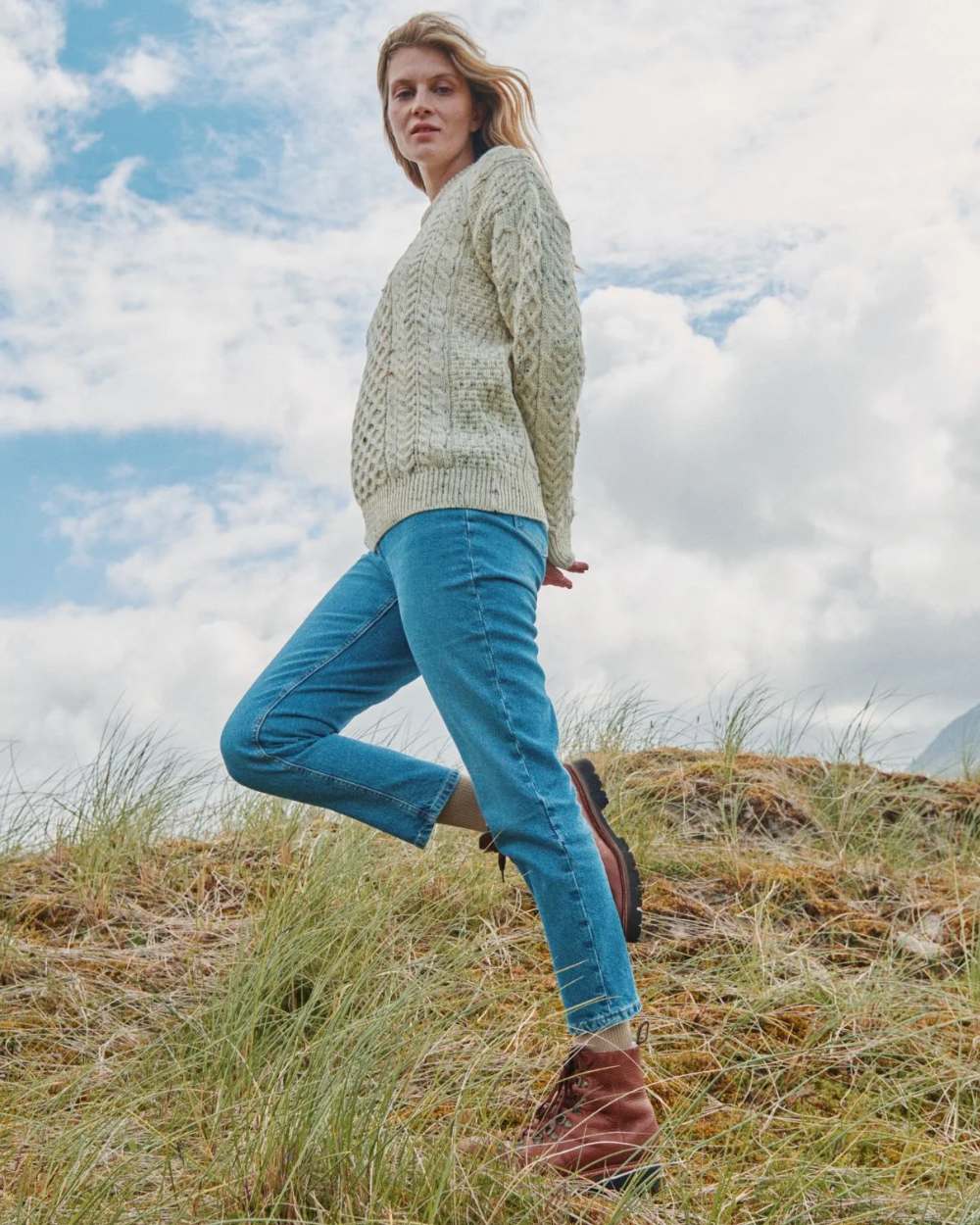 Flecked Cream coloured Aran Inishbofin Traditional Sweater on hillside background 