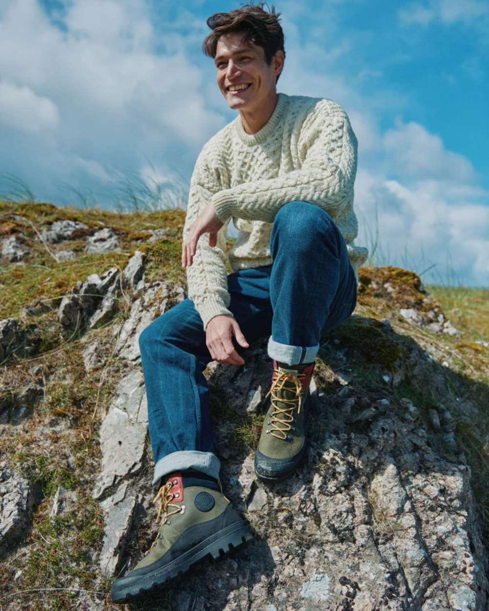 Flecked Cream coloured Aran Inishbofin Traditional Sweater on hillside background 