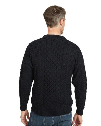 Black Coloured Aran Inisheer Traditional Sweater on white background 