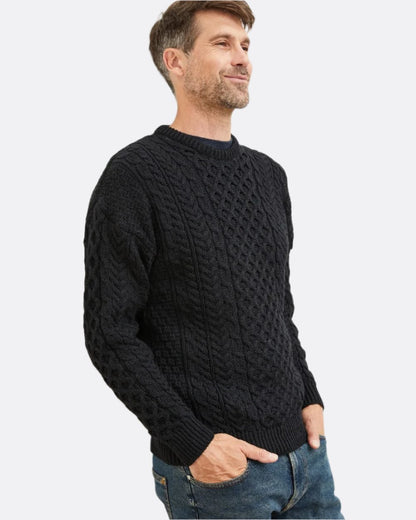 Black Coloured Aran Inisheer Traditional Sweater on white background 