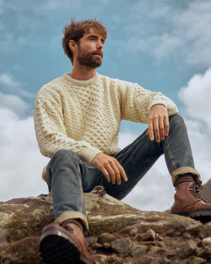 Cream Coloured Aran Inisheer Traditional Sweater on sky background 