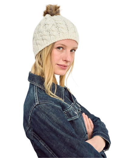 Cream Coloured Aran Knitted Faux Fur Bobble Hat on white background 