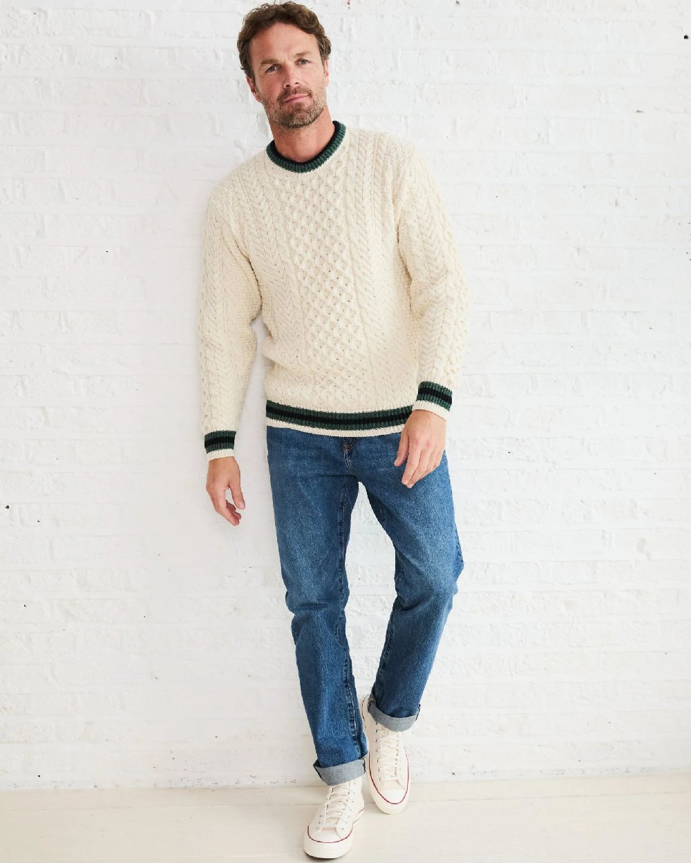 Cream Coloured Aran Mens Inishbeg Stripe Crewneck Merino Sweater on indoor background 