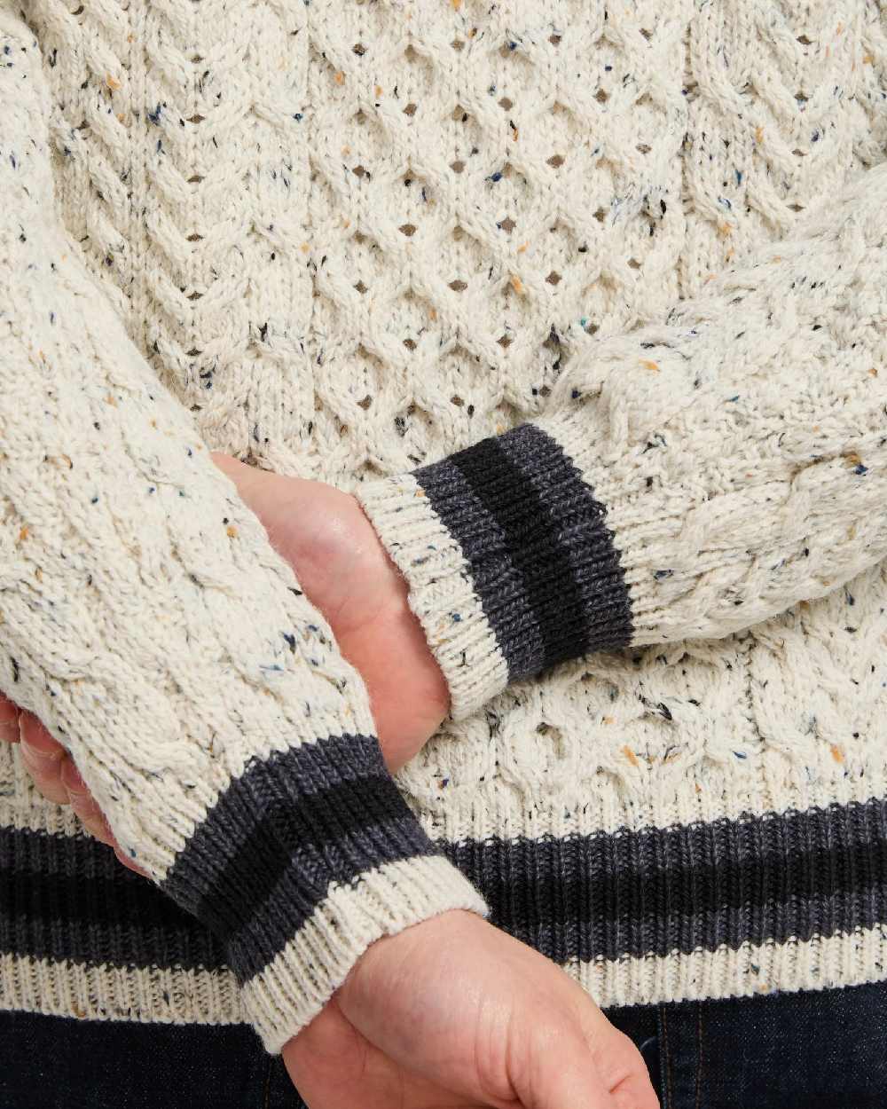 Flecked Cream Coloured Aran Mens Inishbeg Stripe Crewneck Merino Sweater on white background 