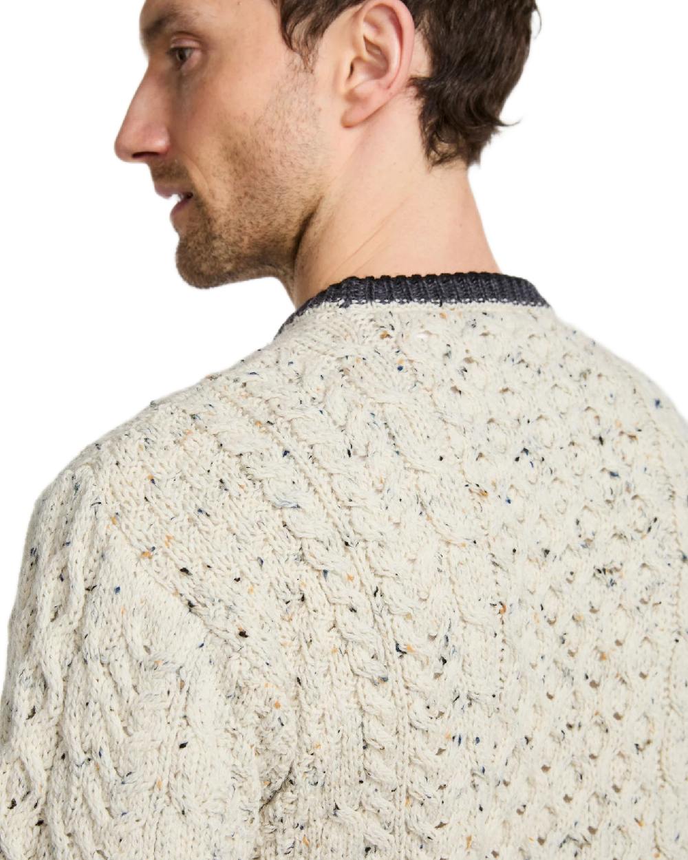 Flecked Cream Coloured Aran Mens Inishbeg Stripe Crewneck Merino Sweater on white background 