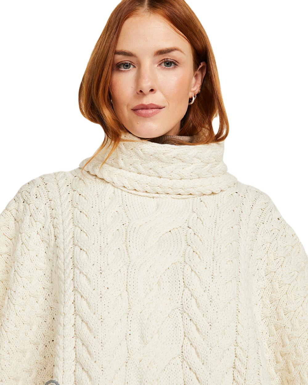 Cream Coloured Aran Merino Wool Cowl Neck Poncho on white background 