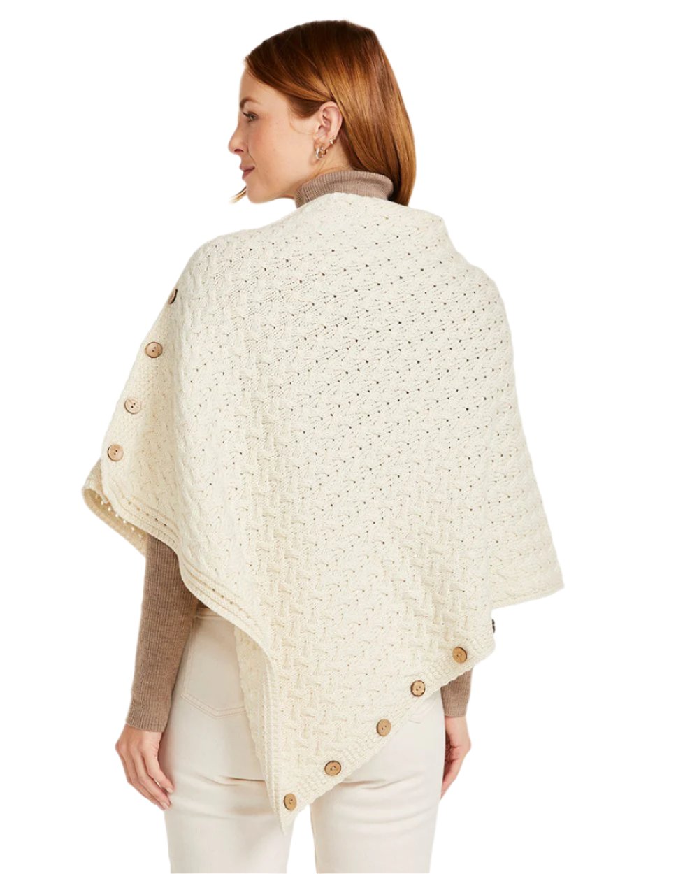 Cream Coloured Aran Merino Wool Knit Button Poncho on white background 