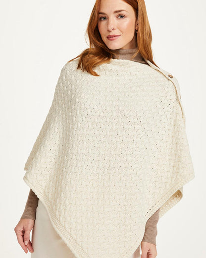 Cream Coloured Aran Merino Wool Knit Button Poncho on white background 