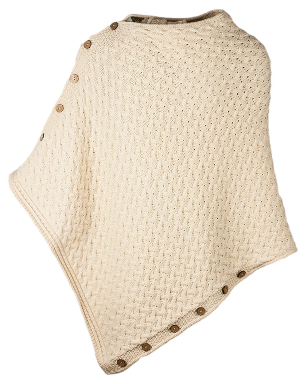 Cream Coloured Aran Merino Wool Knit Button Poncho on white background 