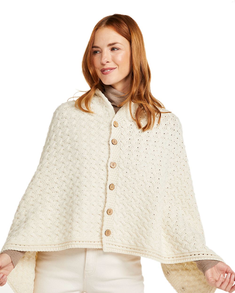 Cream Coloured Aran Merino Wool Knit Button Poncho on white background 