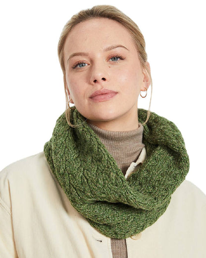 Green coloured Aran Merino Wool Snood on white background 