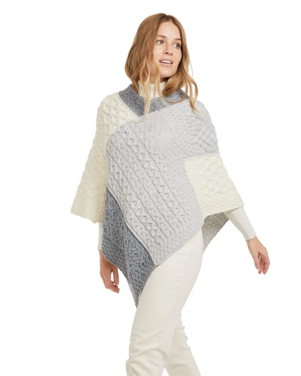 Dawn Coloured Aran Salthill Poncho on white background 