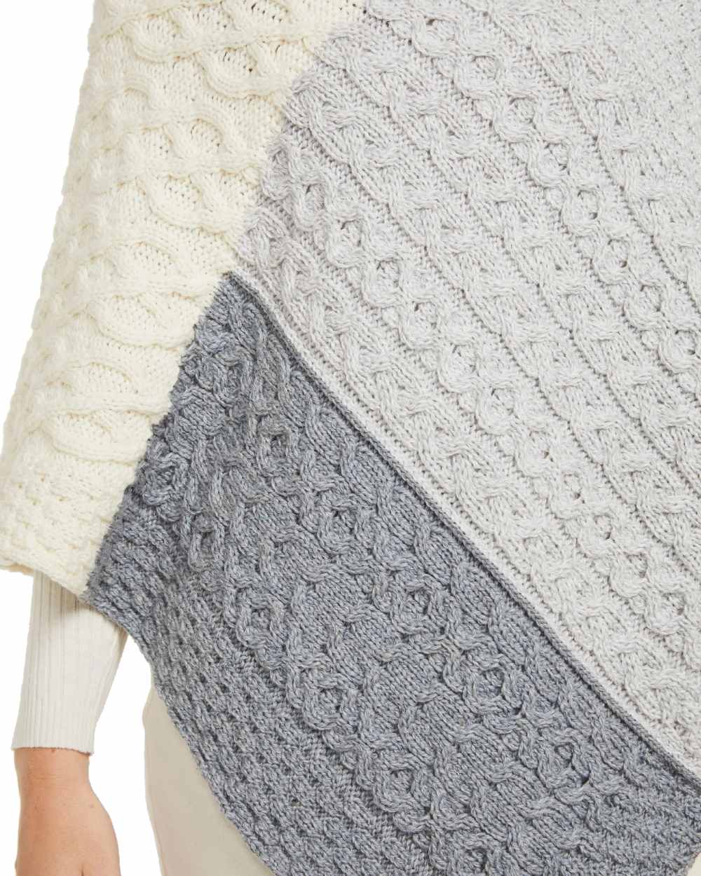 Dawn Coloured Aran Salthill Poncho on white background 