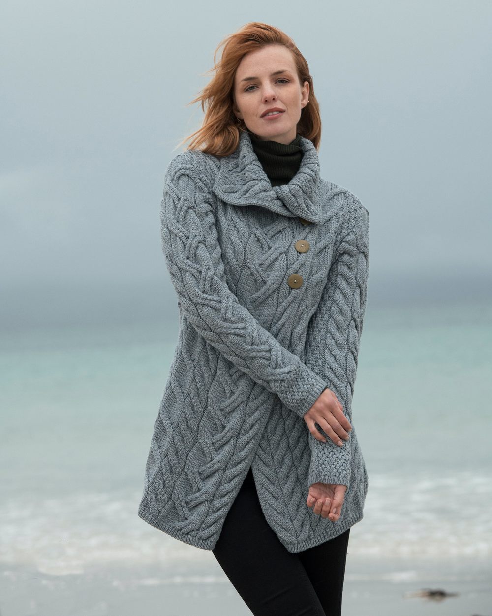 Ocean Grey Coloured Aran Supersoft Merino Wool Long Cardigan on blurry background 