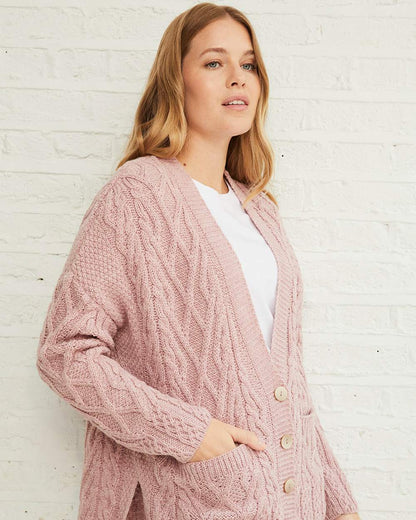 Blush Pink Coloured Aran Valentia Trellis Womens Cardigan on grey wall background 