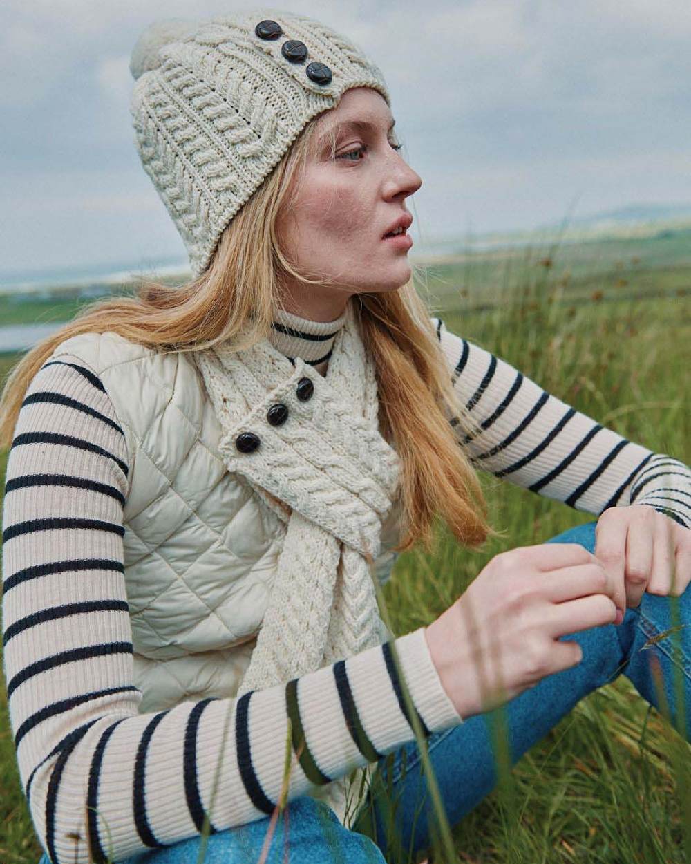 Cream Coloured Aran Womens Ballina Buttoned Loop Scarf on outdoor background 