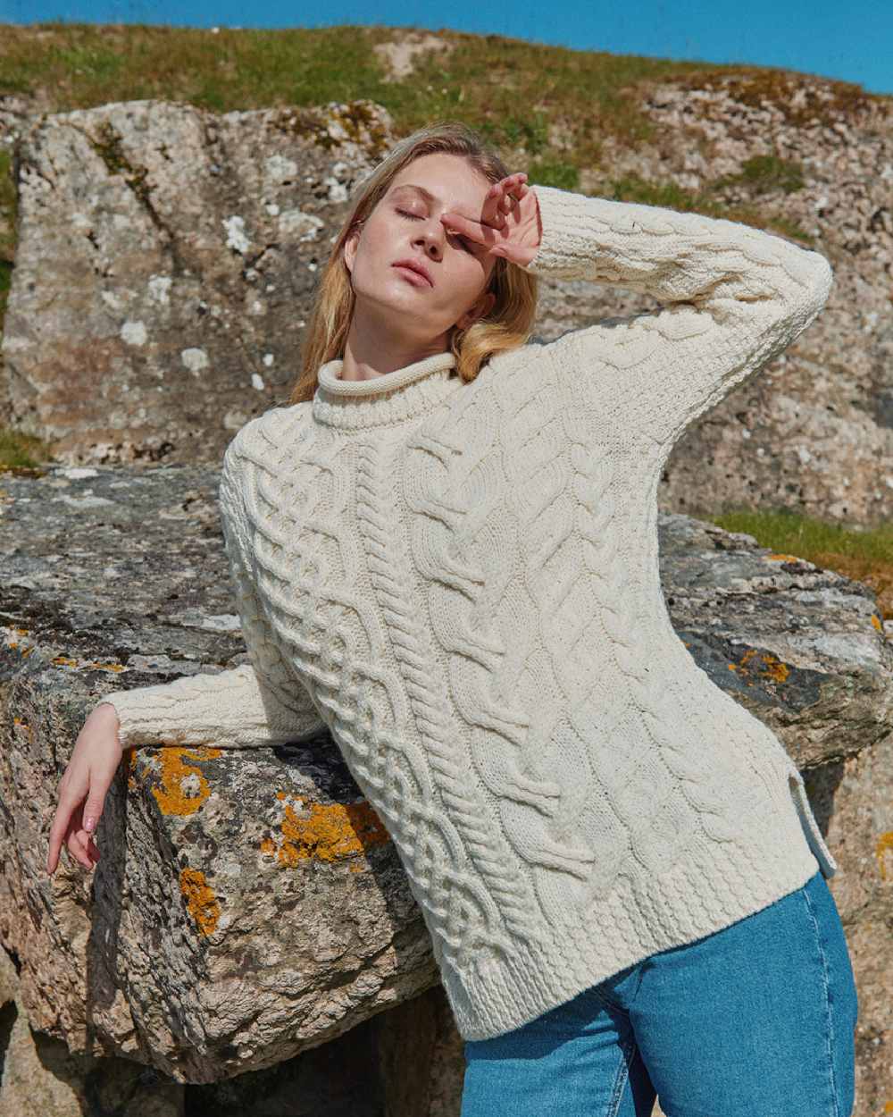 Cream Coloured Aran Womens Calla Aysmmetrical Pattern Sweater on outdoor background 