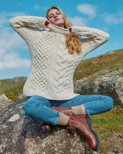 Cream Coloured Aran Womens Calla Aysmmetrical Pattern Sweater on outdoor background 