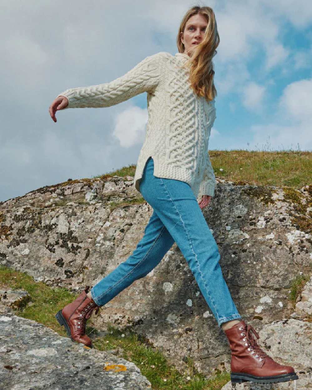 Cream Coloured Aran Womens Calla Aysmmetrical Pattern Sweater on outdoor background 