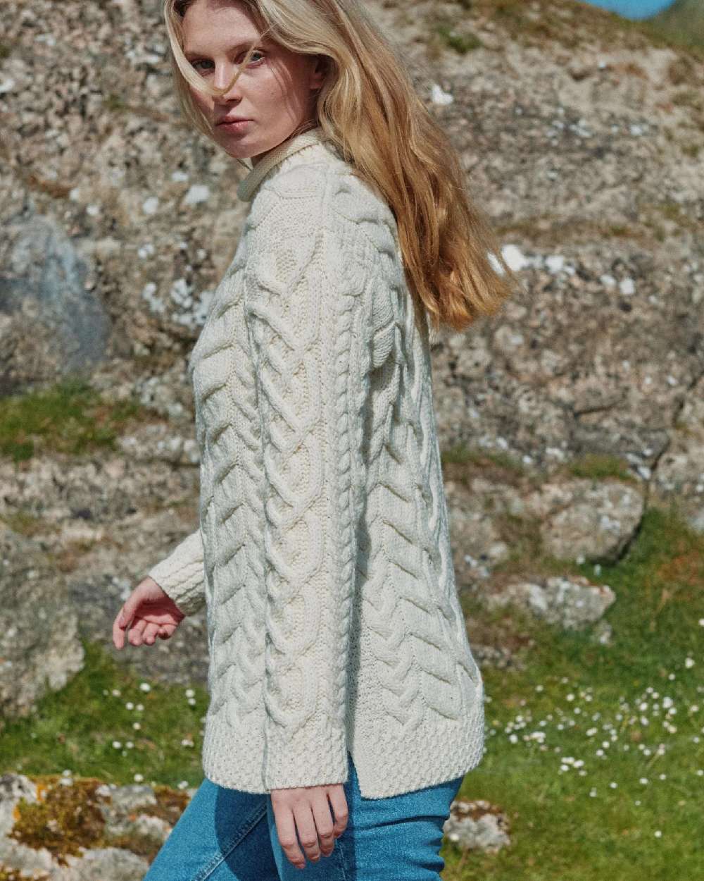 Cream Coloured Aran Womens Calla Aysmmetrical Pattern Sweater on outdoor background 