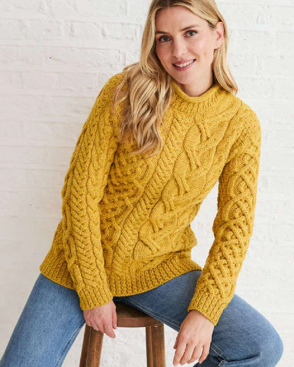 Yellow Coloured Aran Womens Calla Aysmmetrical Pattern Sweater on indoor background 