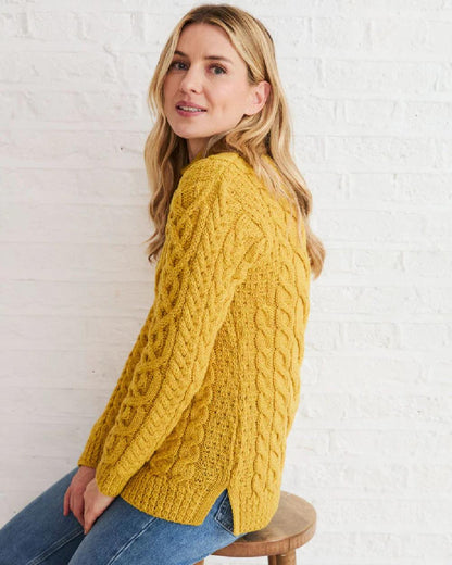 Yellow Coloured Aran Womens Calla Aysmmetrical Pattern Sweater on indoor background 